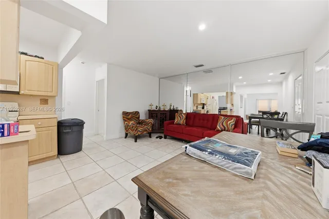 a living room with furniture and a table