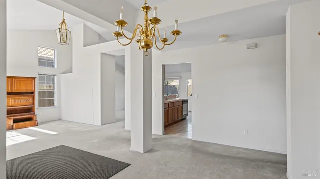 a bathroom with a granite countertop sink and a window