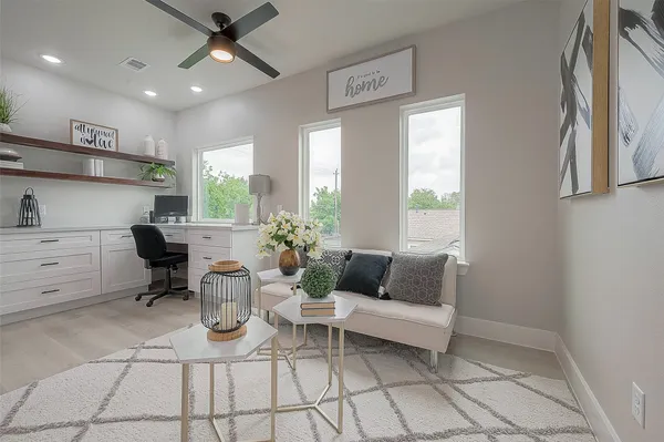 a living room with furniture and white walls