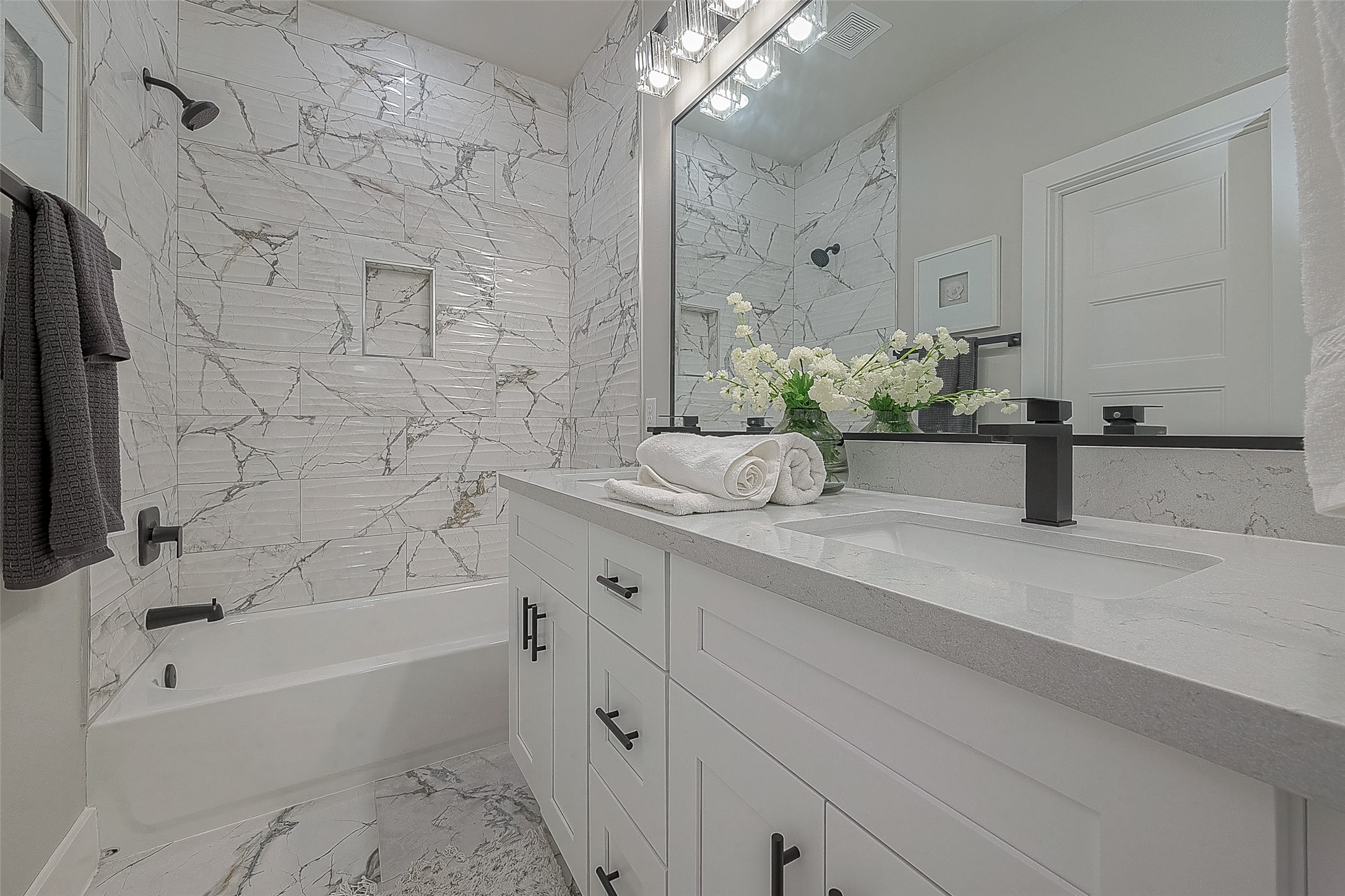 7108 St Augustine Street Houston, TX 77021 - Photo 7 of 21 a bathroom with a granite countertop sink a toilet and bathtub