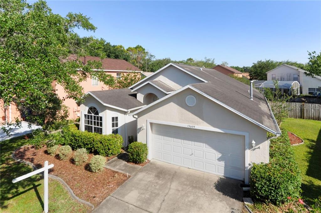 13009 Falcon Ridge Drive Orlando, FL 32828 - Photo 1 of 1 Front facade with upgraded landscaping