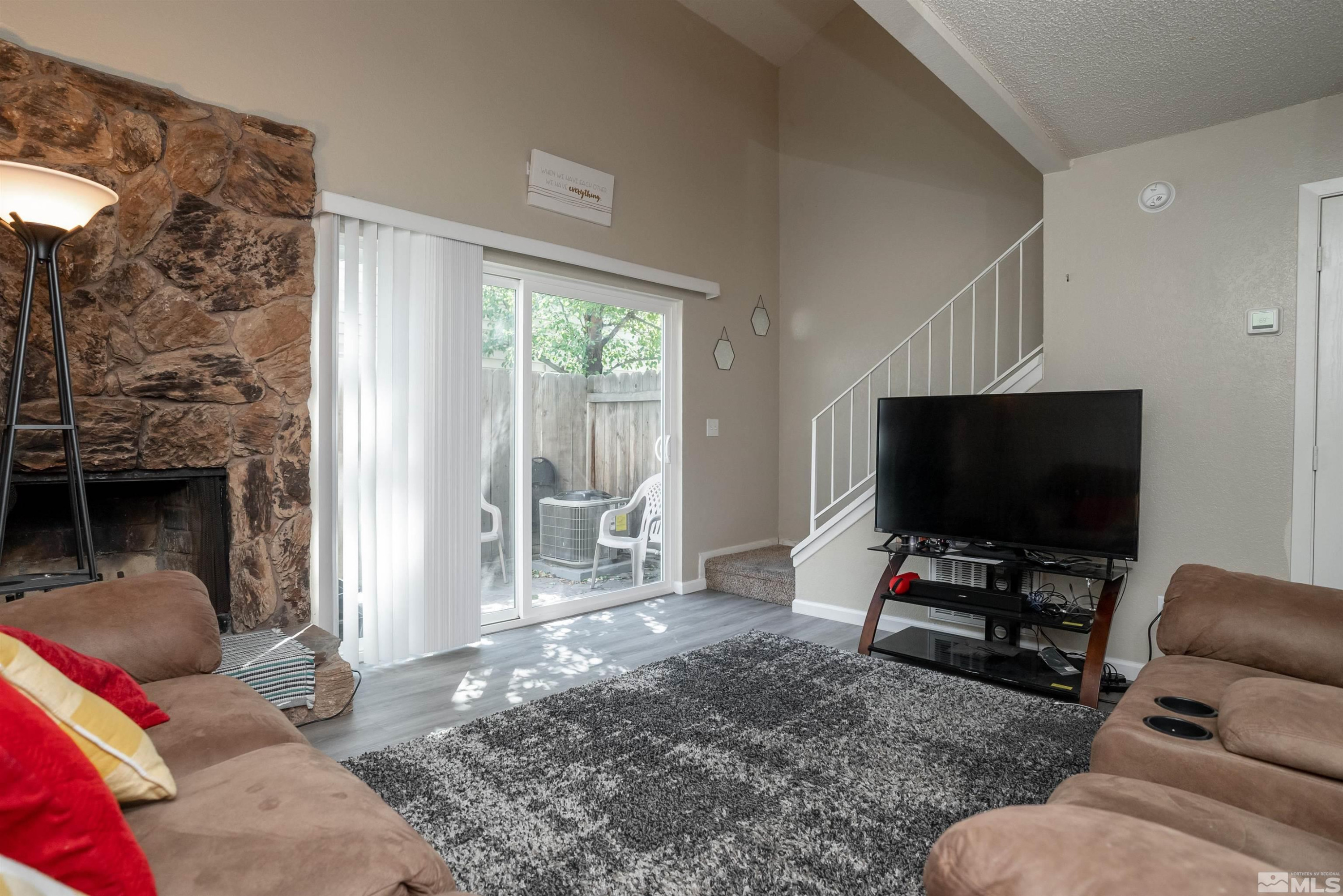 13864 Lear Boulevard Reno, NV 89506 - Photo 12 of 31 a living room with furniture and a flat screen tv