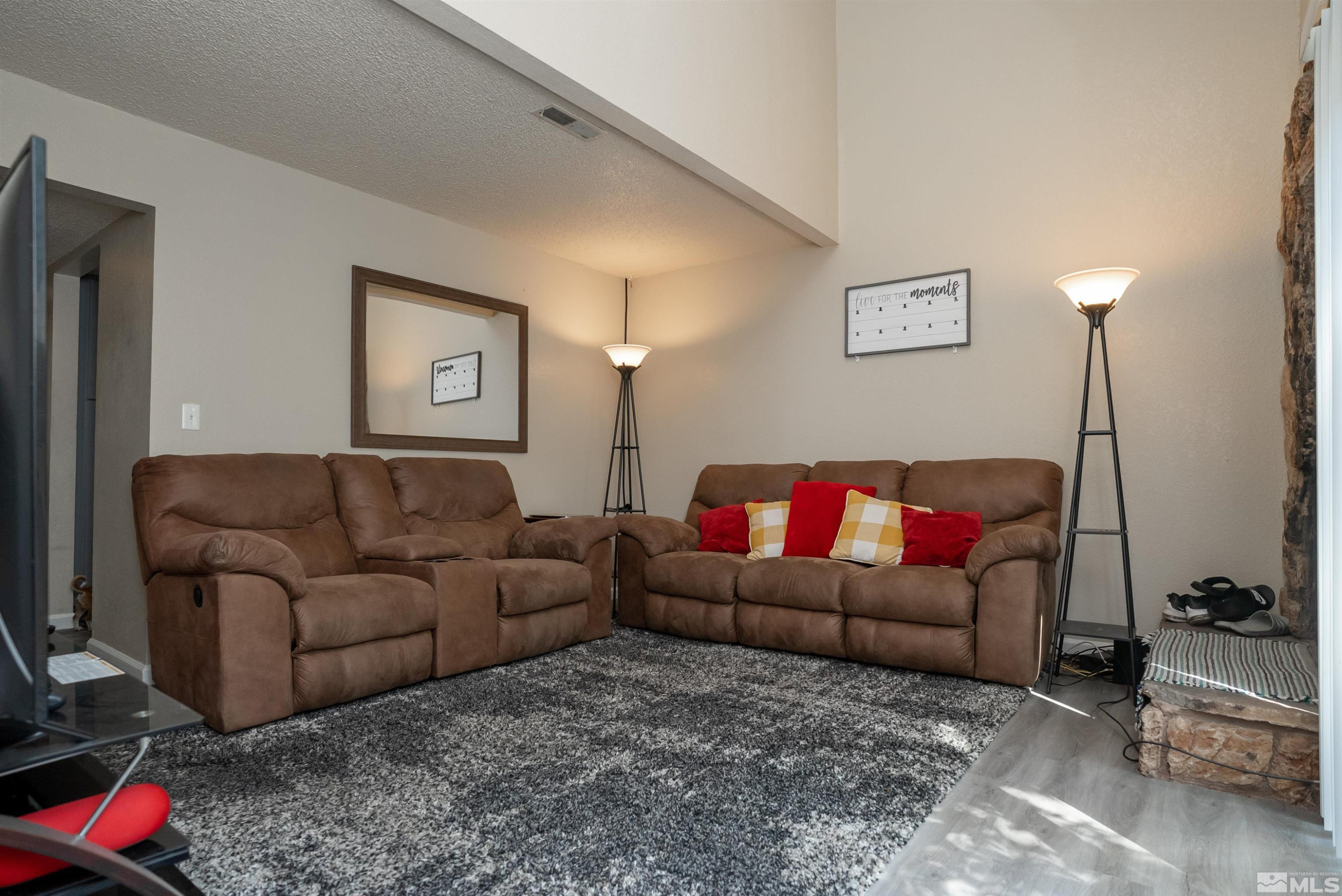 13864 Lear Boulevard Reno, NV 89506 - Photo 15 of 31 a living room with furniture and a couch