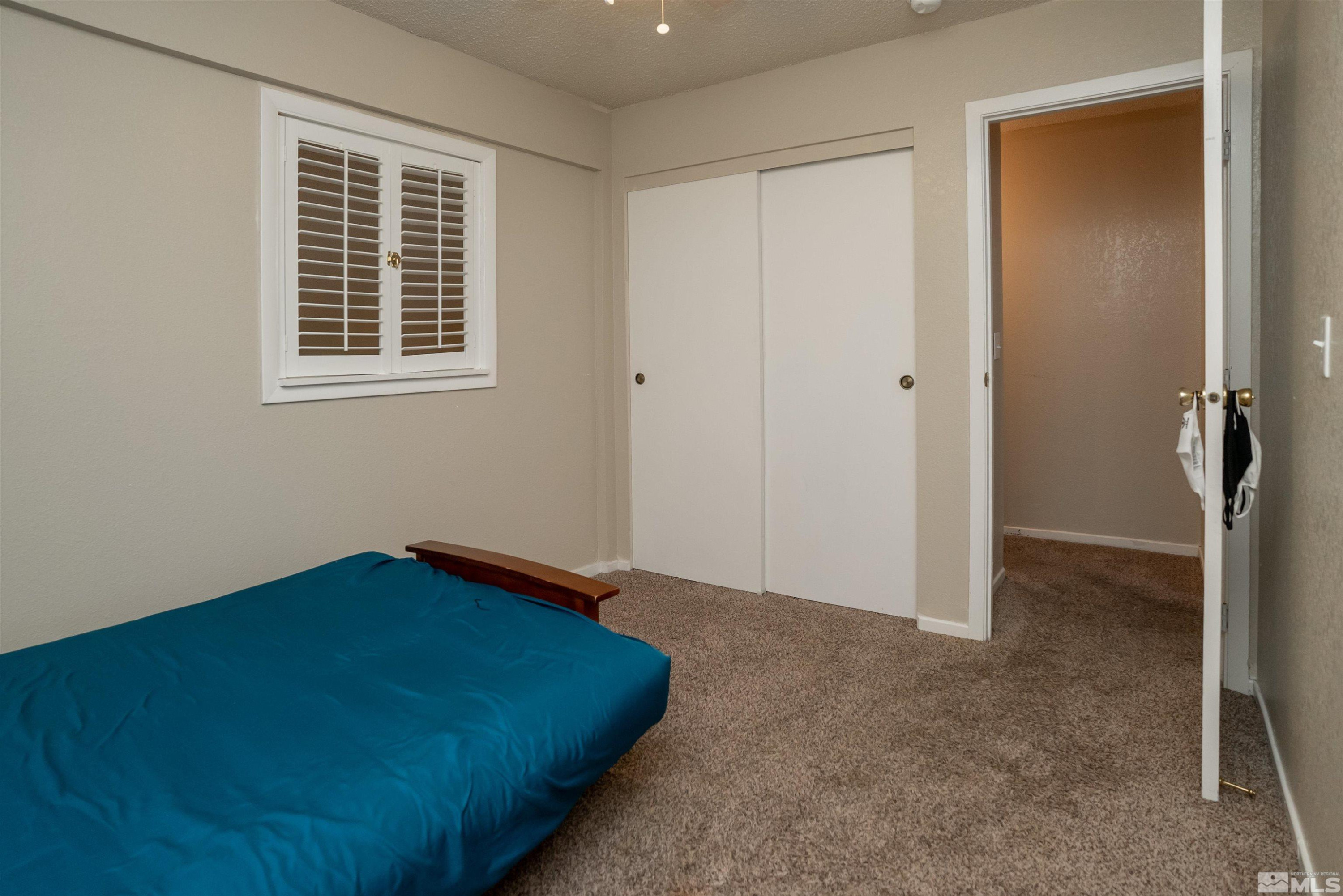 13864 Lear Boulevard Reno, NV 89506 - Photo 19 of 31 a view of empty room with windows