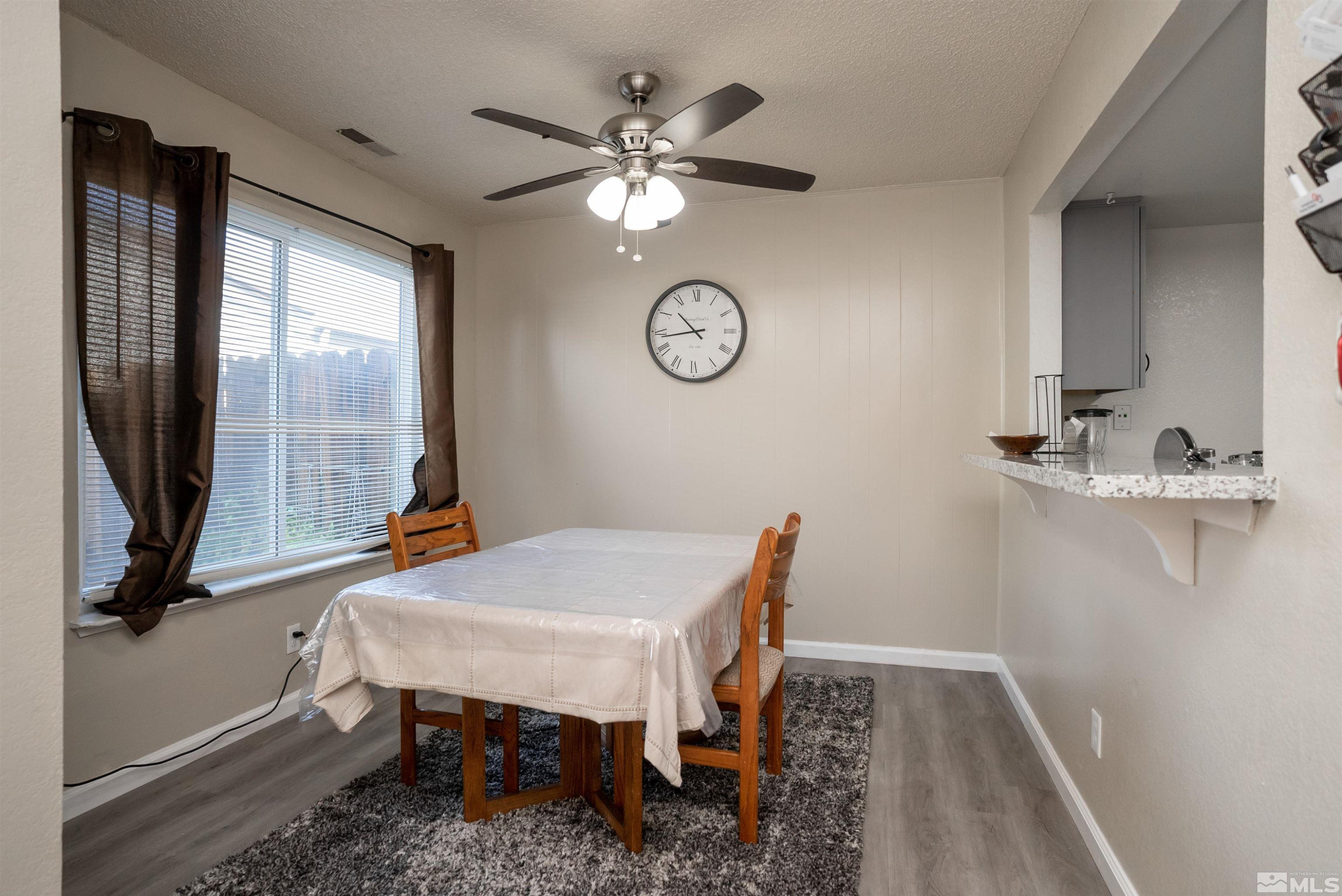 13864 Lear Boulevard Reno, NV 89506 - Photo 2 of 31 a view of a room with furniture window and wooden floor