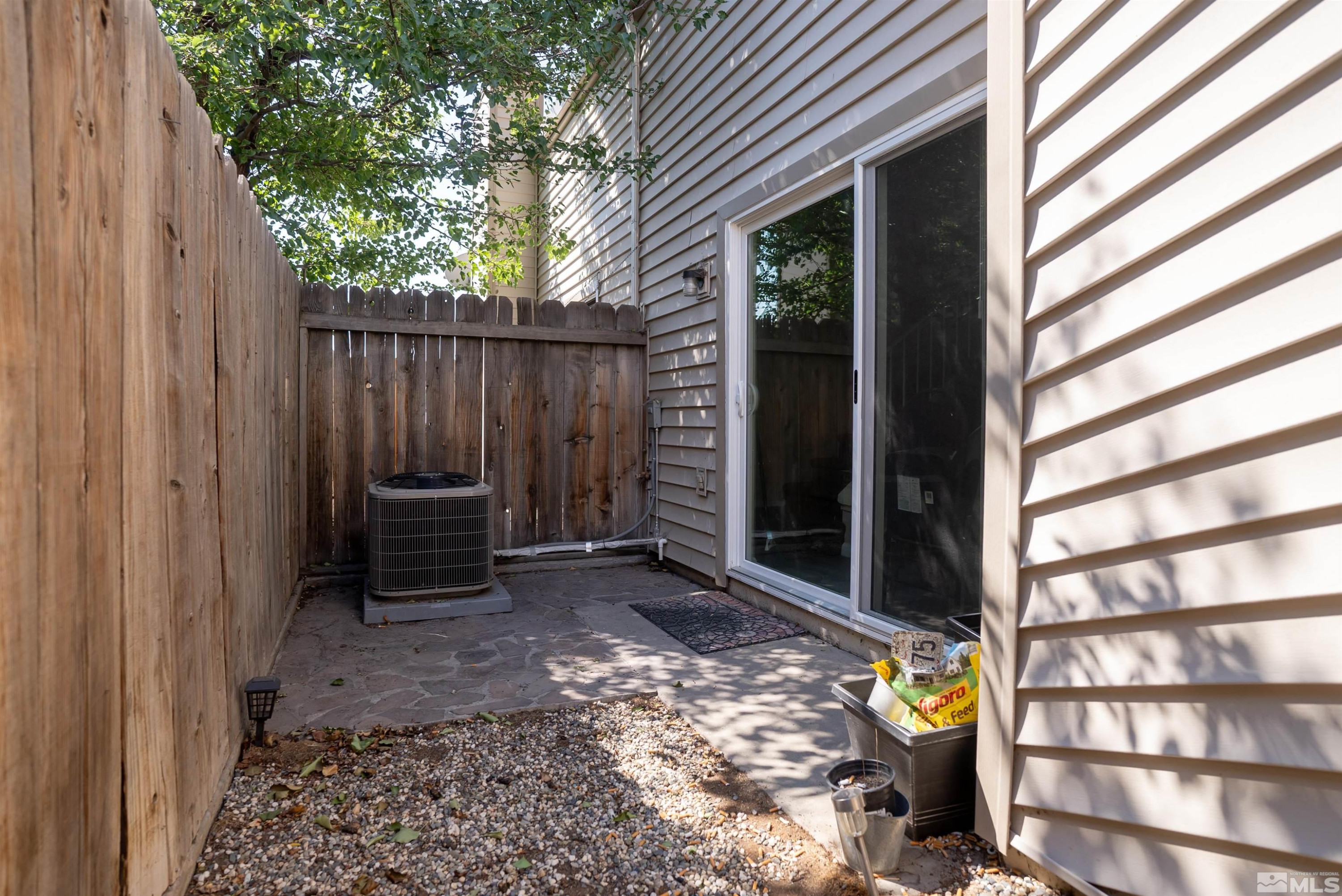 13864 Lear Boulevard Reno, NV 89506 - Photo 27 of 31 a view of a house with a chairs in a patio