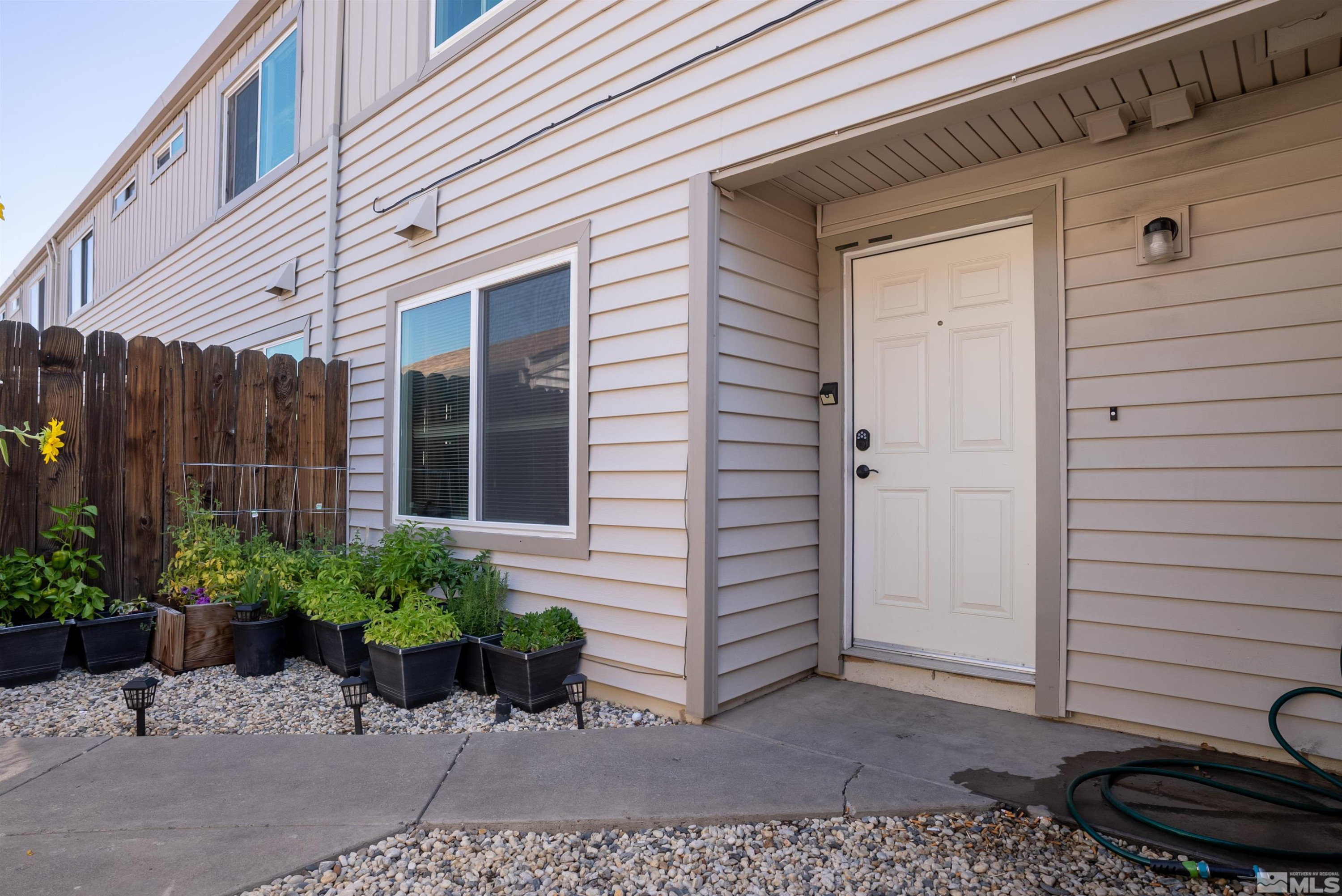 13864 Lear Boulevard Reno, NV 89506 - Photo 29 of 31 a view of a potted plant in front of a house
