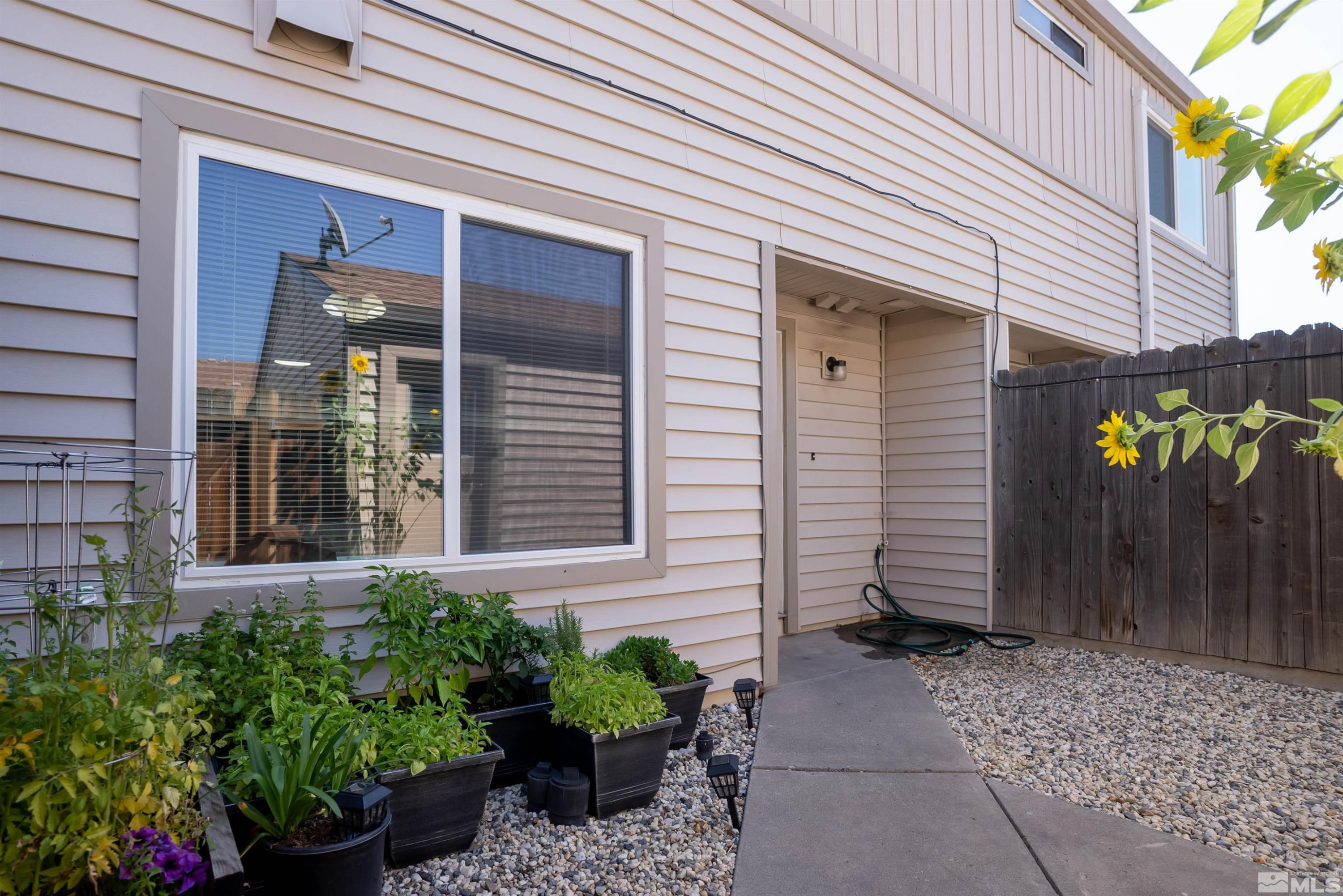 13864 Lear Boulevard Reno, NV 89506 - Photo 30 of 31 a front view of a house with a garden