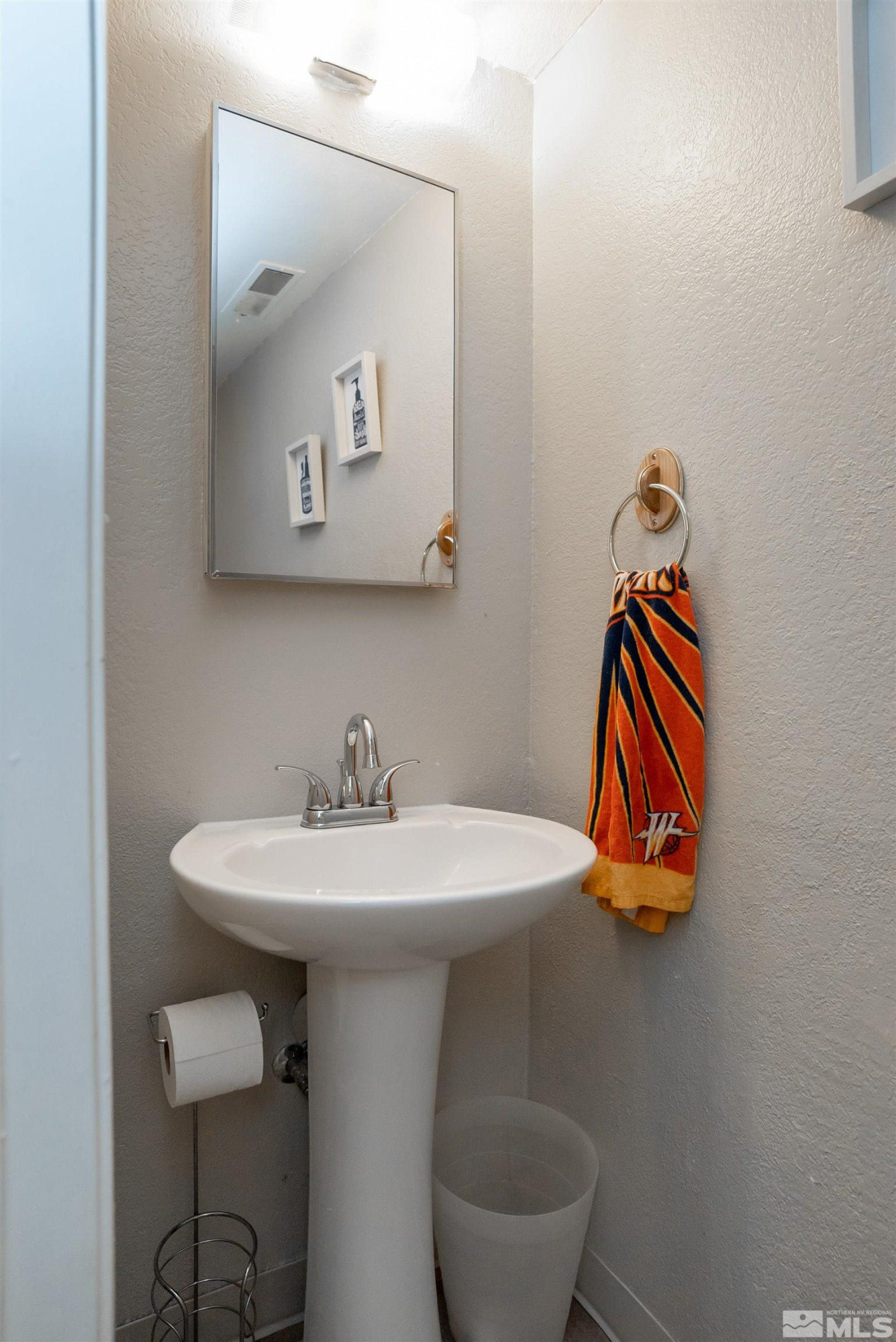 13864 Lear Boulevard Reno, NV 89506 - Photo 4 of 31 a bathroom with a sink and a mirror