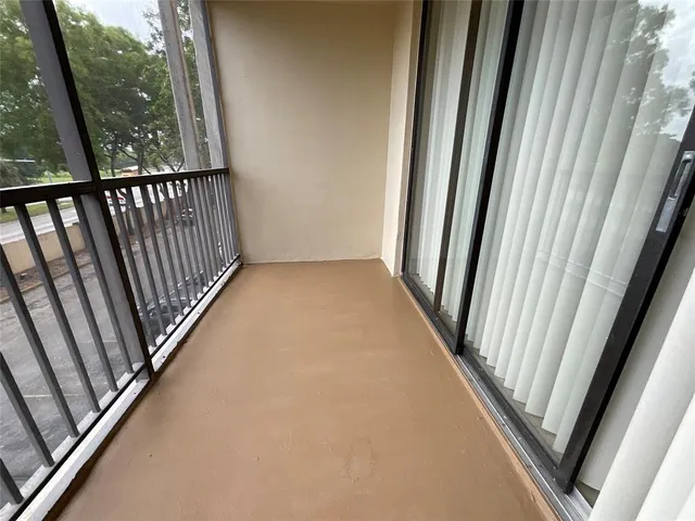 a view of a hallway with windows