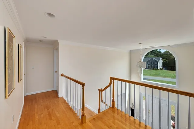 a view of staircase with rug