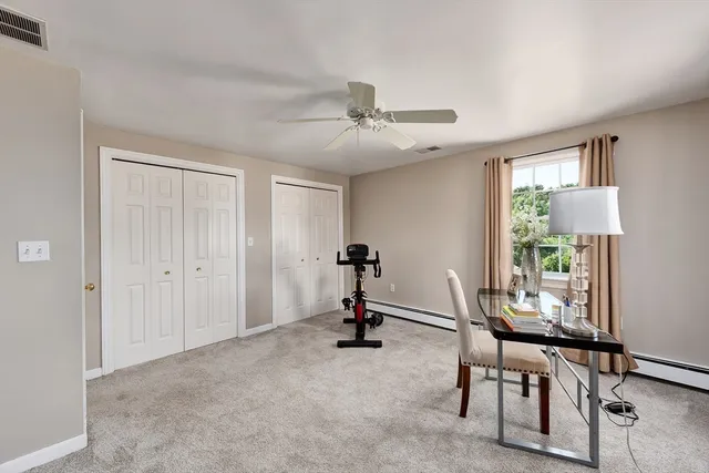 a view of a livingroom with furniture and a window