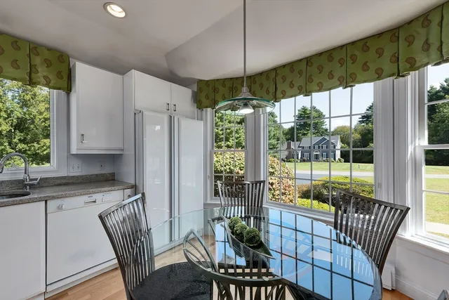 a open kitchen with dining table and chairs
