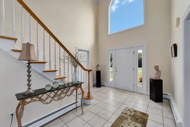 a view of entryway with furniture and rug