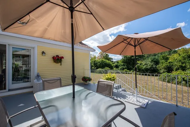 a patio with a patio table and chairs