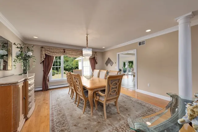 a view of a dining room with furniture window and outside view