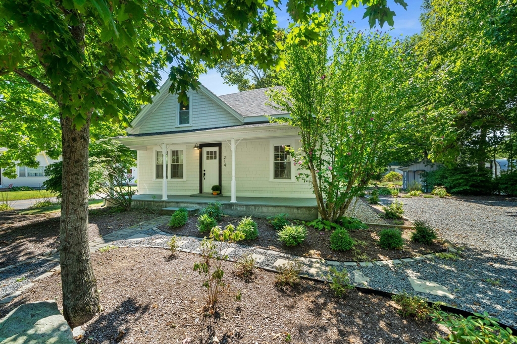 214 Wareham Street Middleboro, MA 02346 - Photo 2 of 37 a front view of a house with a yard and shrubs