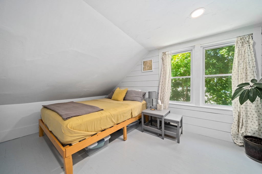 214 Wareham Street Middleboro, MA 02346 - Photo 21 of 37 a bed sitting in a bedroom next to a window