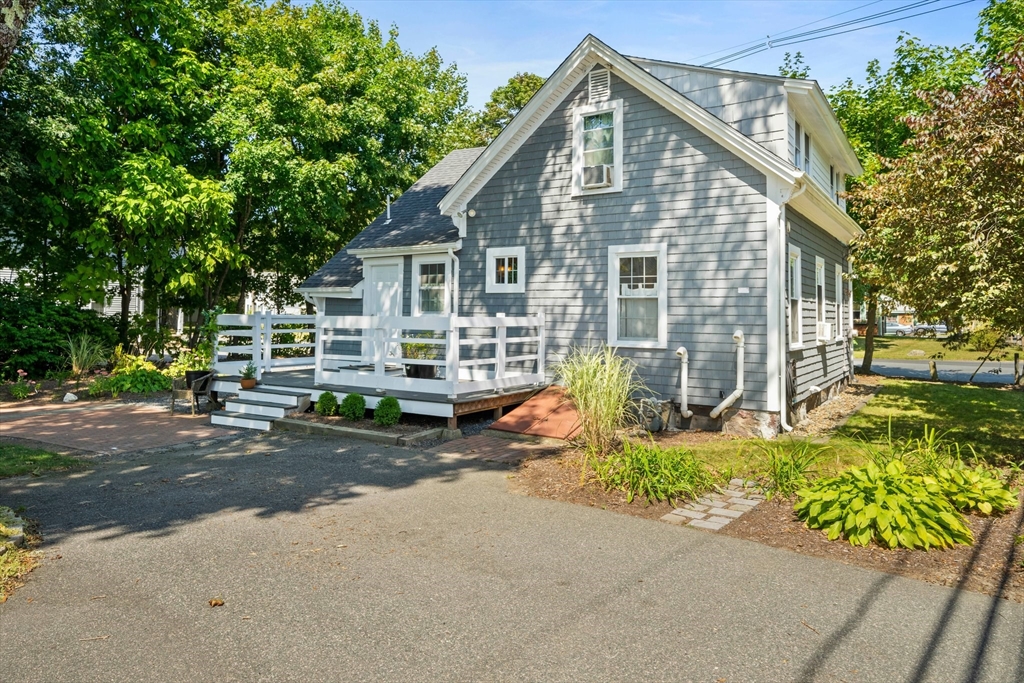 214 Wareham Street Middleboro, MA 02346 - Photo 27 of 37 a view of a house with a yard and sitting area
