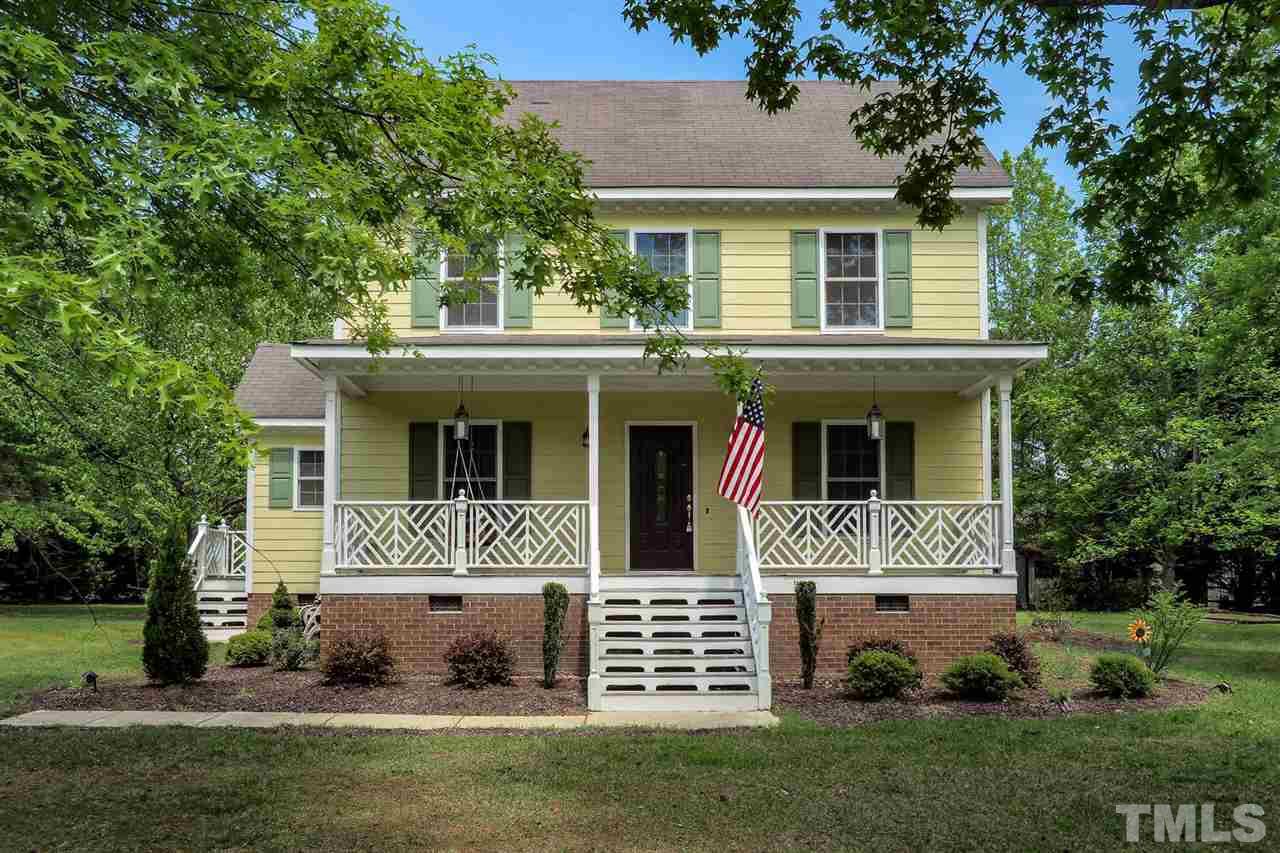 1020 Pagan Road Raleigh, NC 27603 - Photo 1 of 24 a front view of a house with a yard