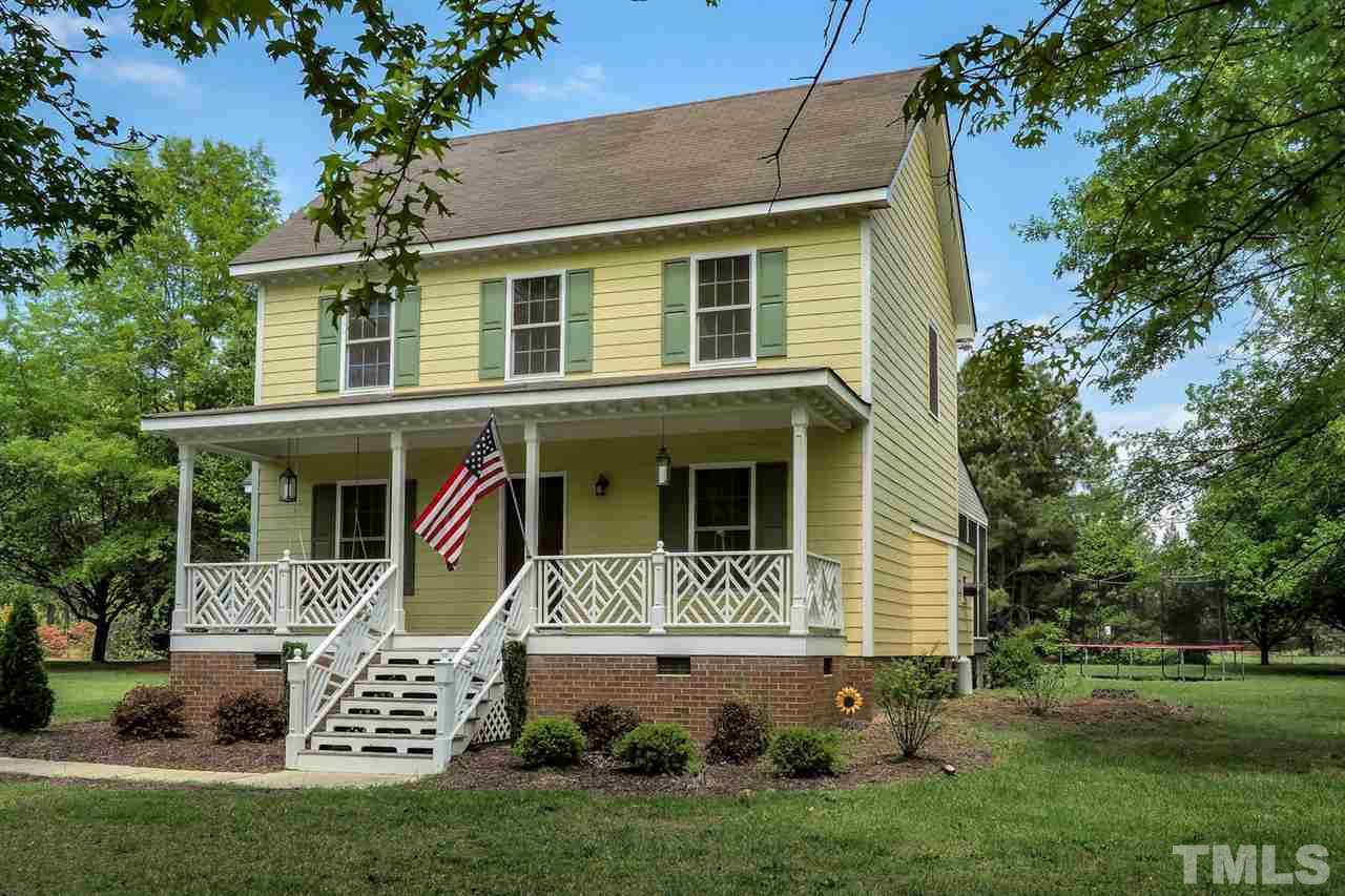 1020 Pagan Road Raleigh, NC 27603 - Photo 2 of 24 a front view of a house with a yard