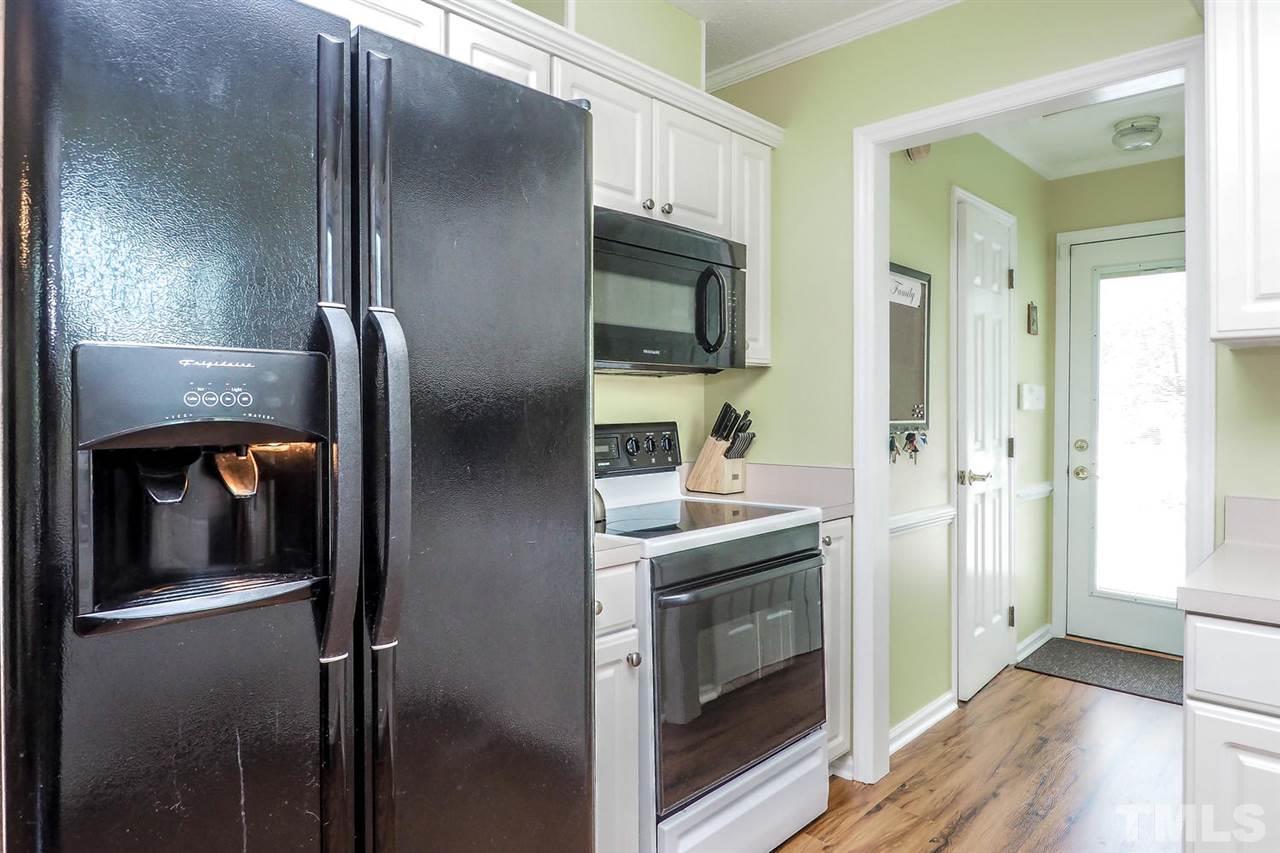 1020 Pagan Road Raleigh, NC 27603 - Photo 12 of 24 a kitchen with a refrigerator and wooden floor