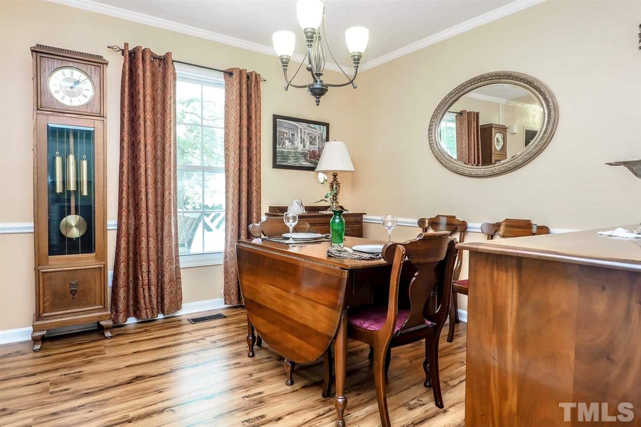 1020 Pagan Road Raleigh, NC 27603 - Photo 13 of 24 a view of a dining room with furniture and a chandelier