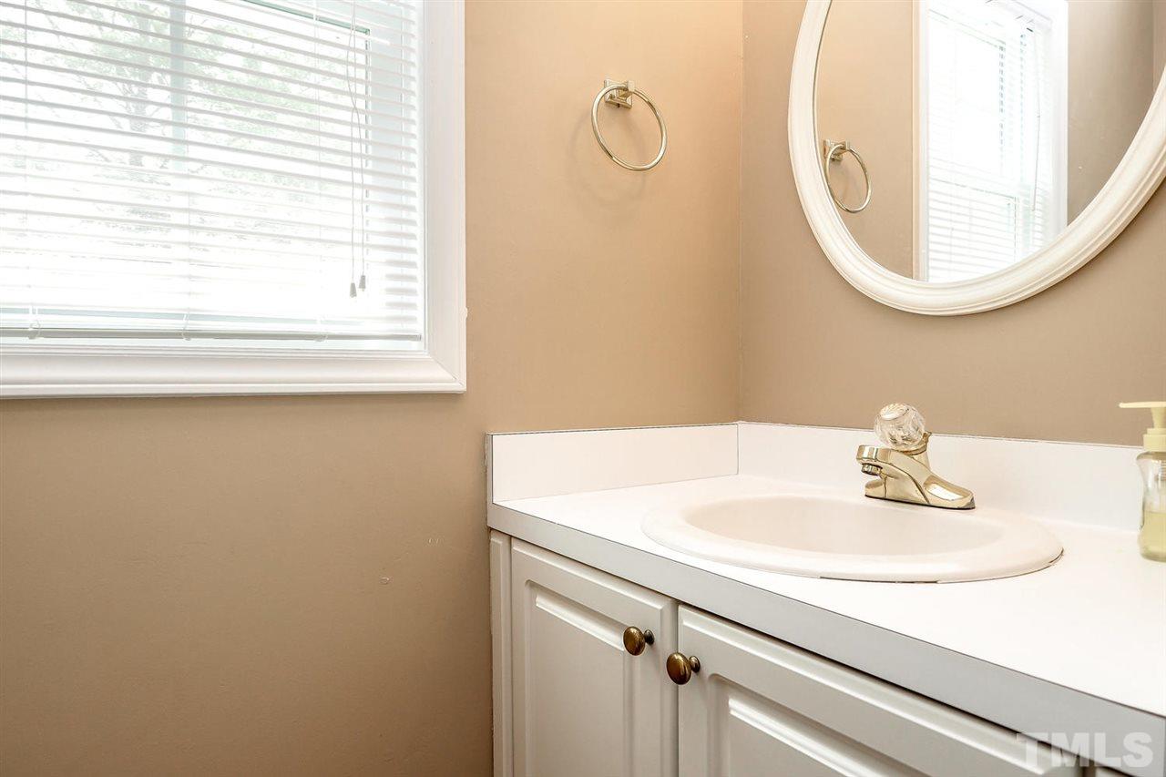 1020 Pagan Road Raleigh, NC 27603 - Photo 15 of 24 a bathroom with a sink and a mirror