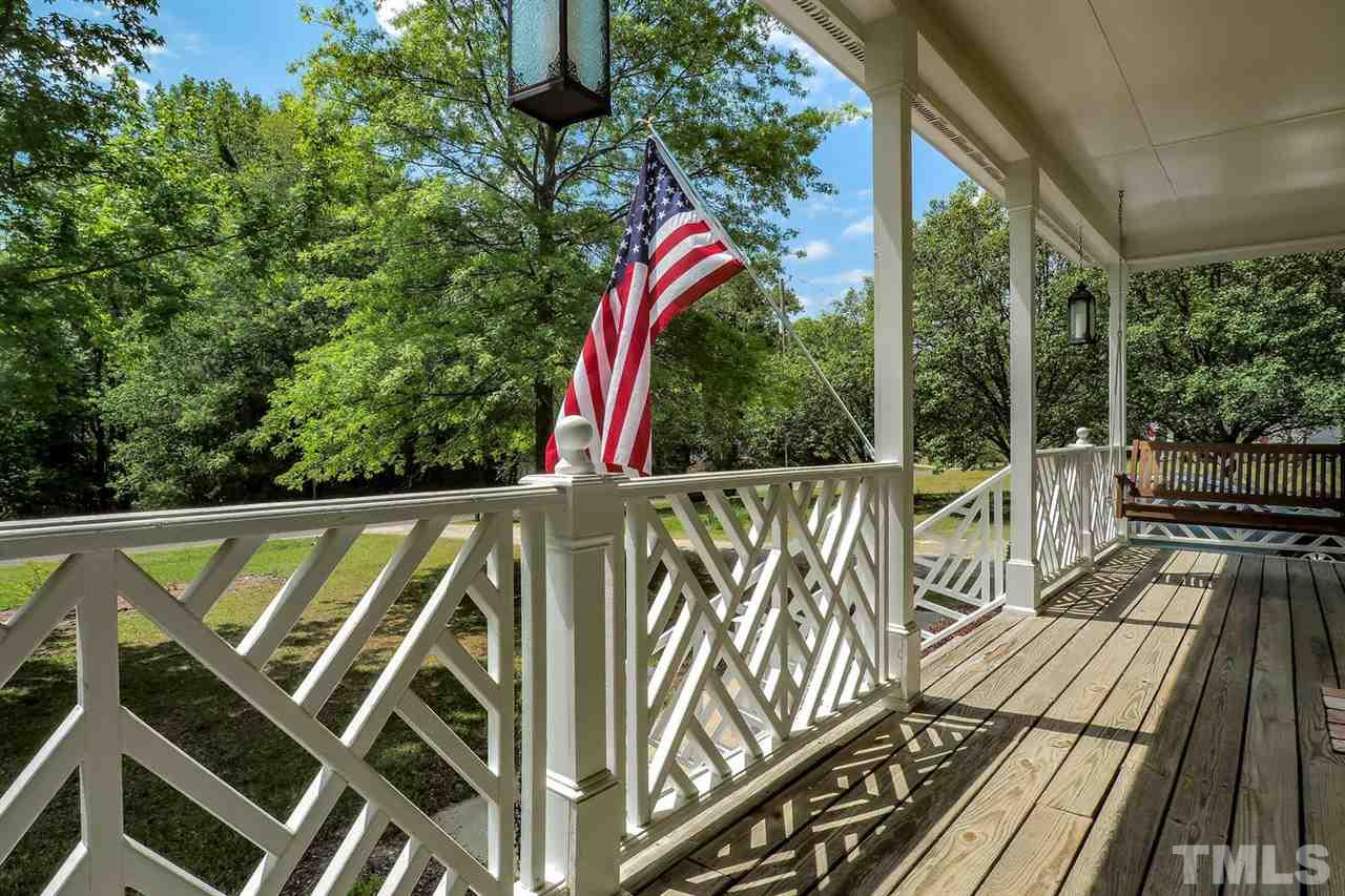 1020 Pagan Road Raleigh, NC 27603 - Photo 3 of 24 a view of a balcony with wooden floor and iron fence