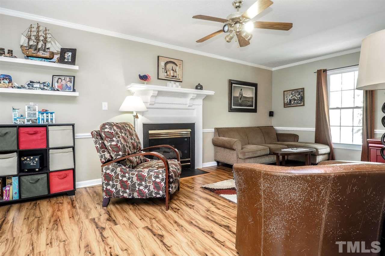 1020 Pagan Road Raleigh, NC 27603 - Photo 5 of 24 a living room with furniture and a fireplace
