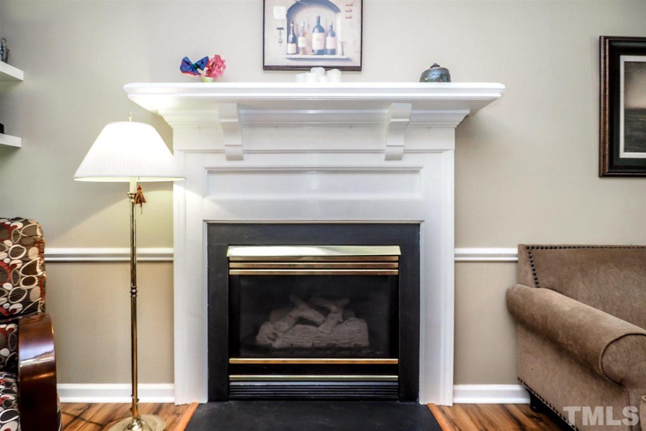 1020 Pagan Road Raleigh, NC 27603 - Photo 6 of 24 a living room with furniture and a fireplace