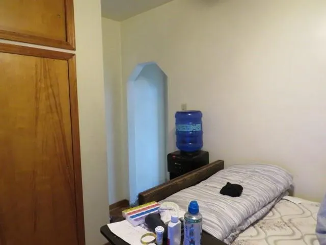 a living room with furniture a couch and a flat screen tv