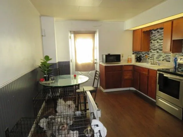 a living room with furniture and a laptop