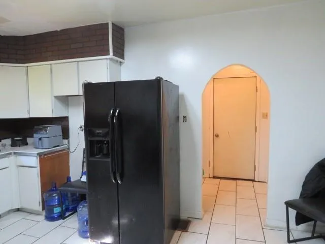 a kitchen with a stove and cabinets