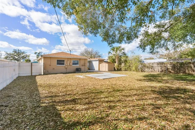 a house view with swimming pool in front of house