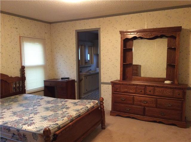 1305 Poplar Ridge Road Chapmansboro, TN 37035 - Photo 10 of 14 Master bedroom with master bath which has handicap accessible shower.