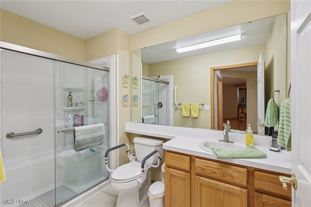 6894 Paradise Way North Ridgeville, OH 44039 - Photo 27 of 36 Primary bath with newer walk-in shower.