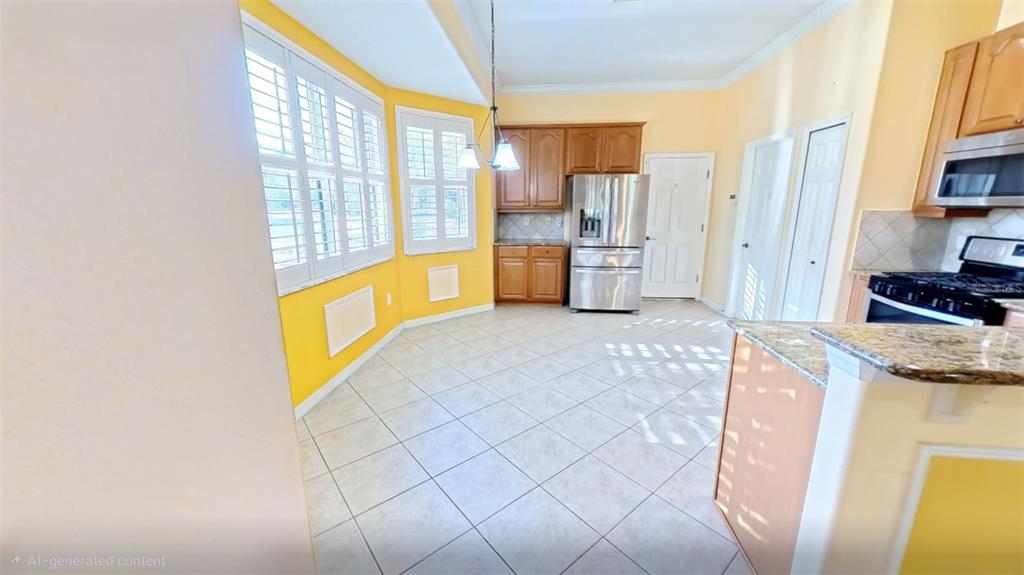 100 Flame Vine Way Groveland, FL 34736 - Photo 13 of 38 a view of kitchen with furniture and large window