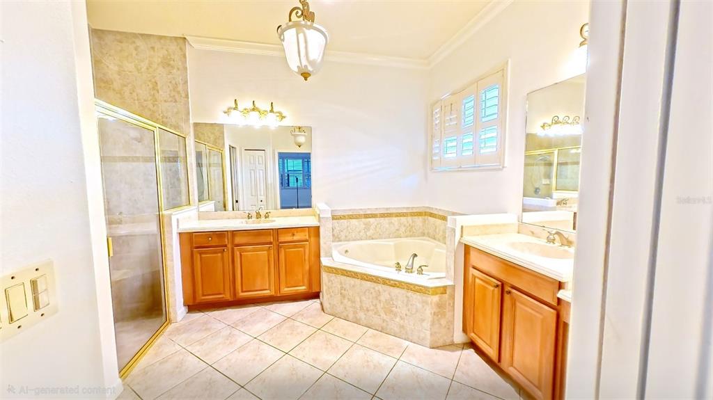 100 Flame Vine Way Groveland, FL 34736 - Photo 20 of 38 a spacious bathroom with a tub sink and mirror