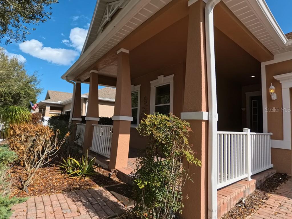 100 Flame Vine Way Groveland, FL 34736 - Photo 2 of 38 a view of a house with backyard and sitting area