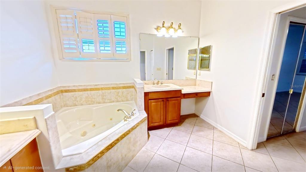 100 Flame Vine Way Groveland, FL 34736 - Photo 21 of 38 a bathroom with a bathtub and a sink
