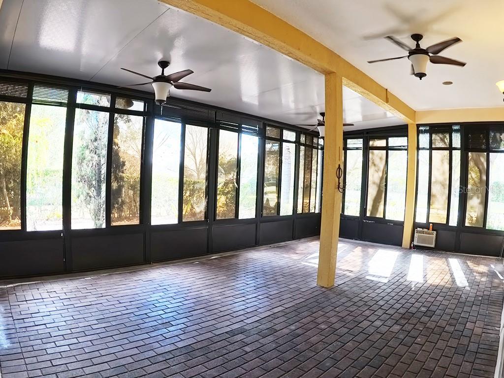 100 Flame Vine Way Groveland, FL 34736 - Photo 26 of 38 a view of an empty room window and wooden floor