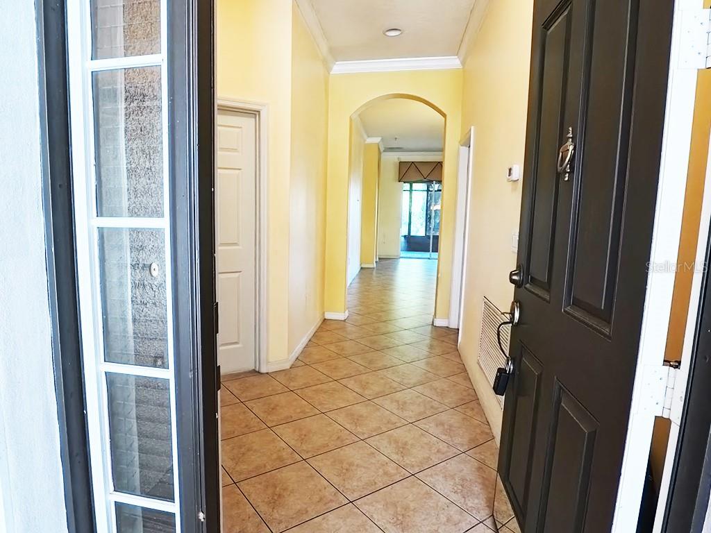 100 Flame Vine Way Groveland, FL 34736 - Photo 3 of 38 a view of a bathroom from a hallway