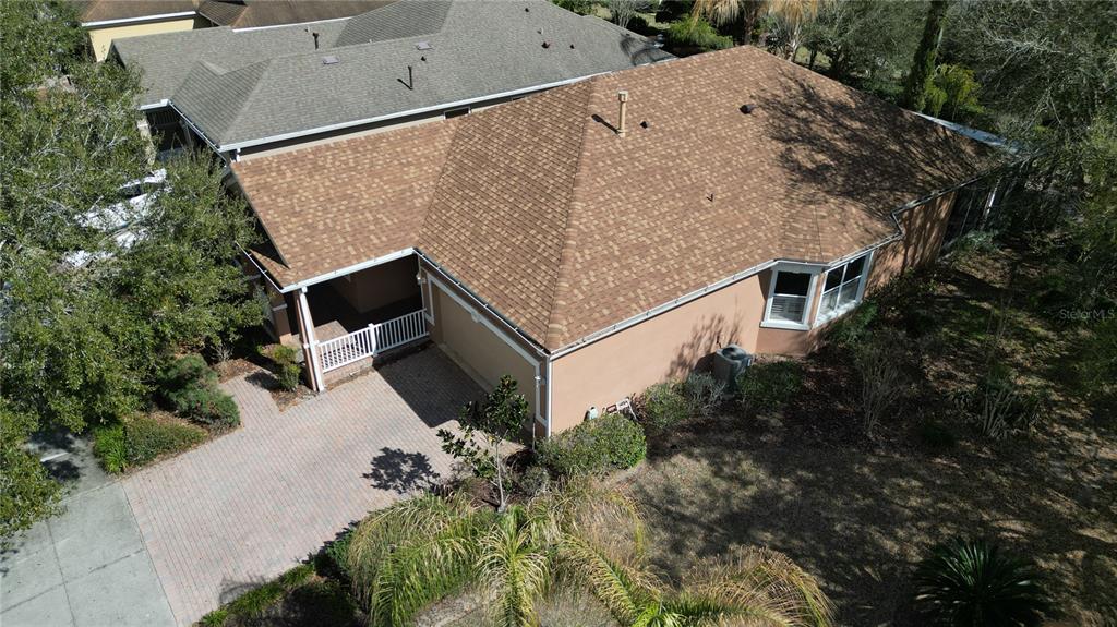 100 Flame Vine Way Groveland, FL 34736 - Photo 31 of 38 an aerial view of a house with large trees