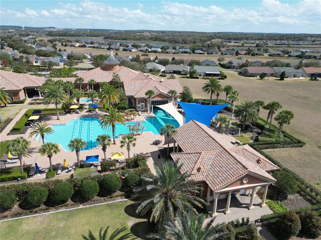 100 Flame Vine Way Groveland, FL 34736 - Photo 34 of 38 an aerial view of a houses with a lake