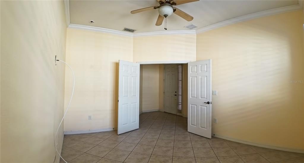 100 Flame Vine Way Groveland, FL 34736 - Photo 7 of 38 a view of a hallway with a bathroom