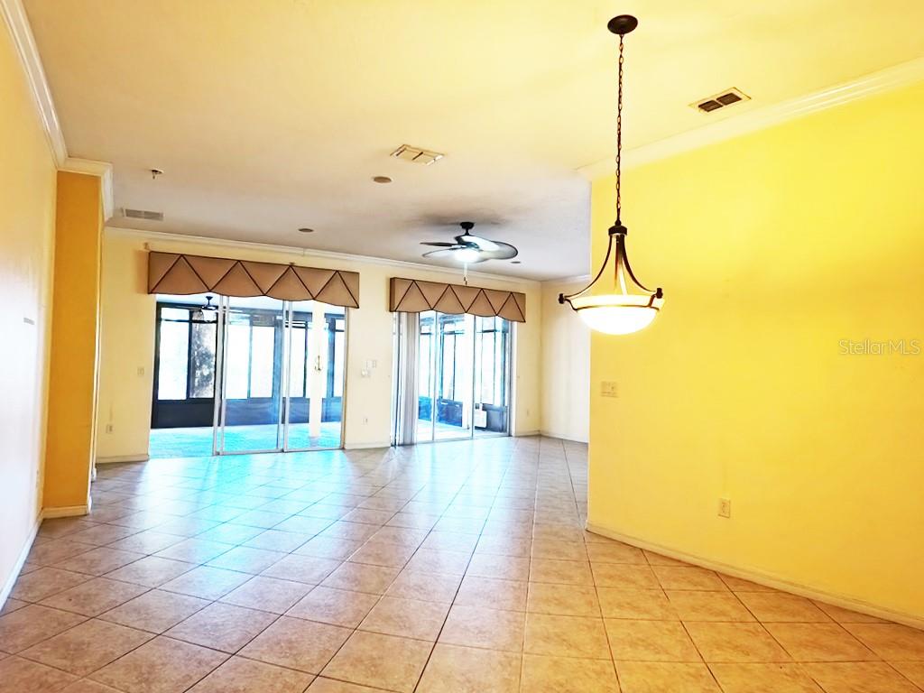 100 Flame Vine Way Groveland, FL 34736 - Photo 10 of 38 a view of an entryway with a chandelier