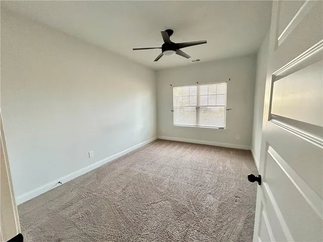 a view of empty room with windows
