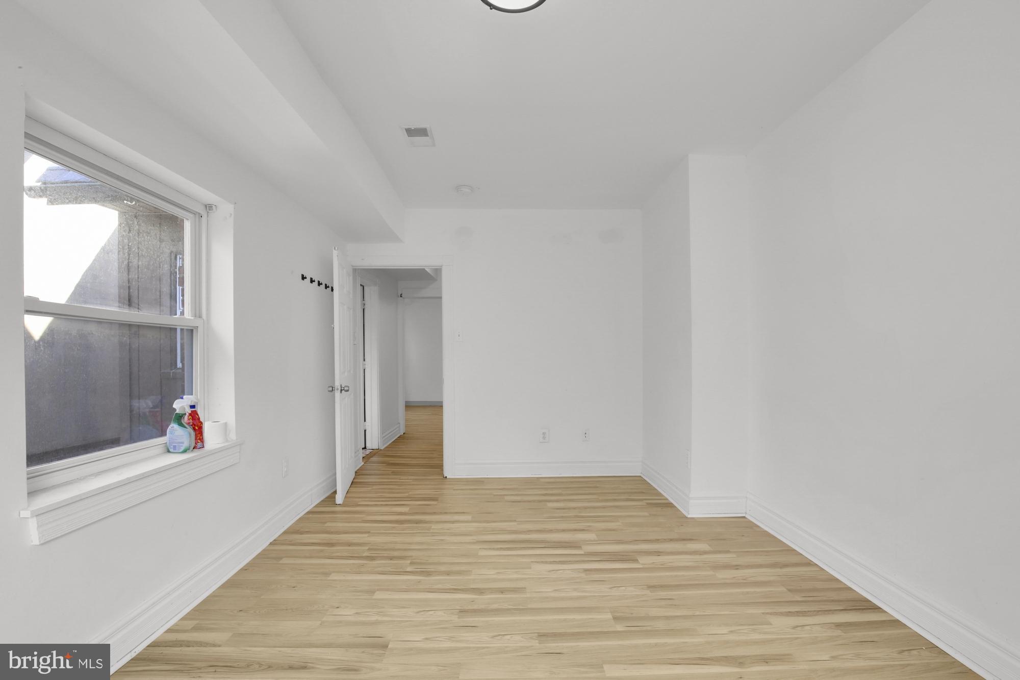 3215 Winter Street Philadelphia, PA 19104 - Photo 15 of 31 a view of an empty room with wooden floor and a window
