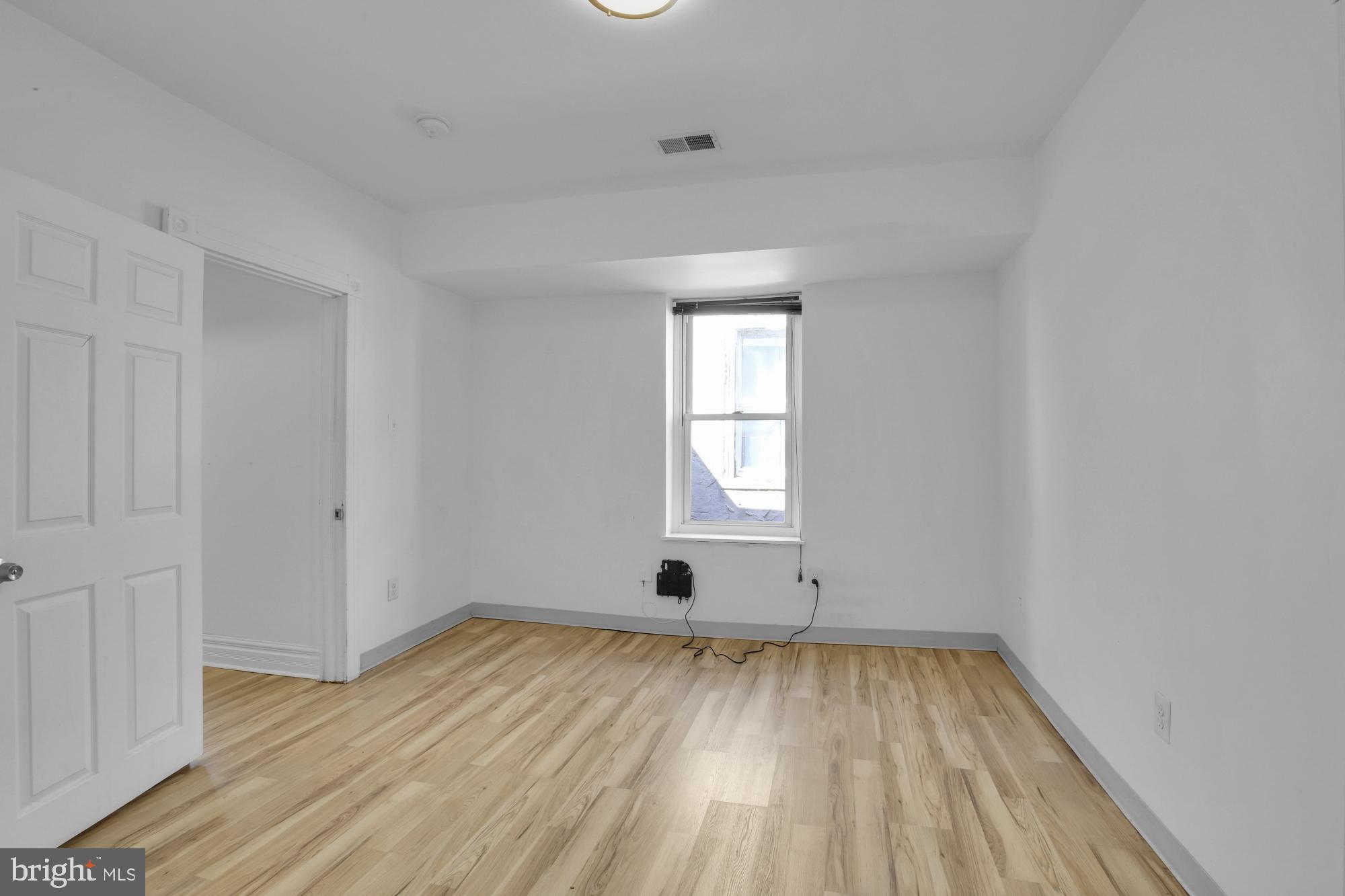 3215 Winter Street Philadelphia, PA 19104 - Photo 18 of 31 wooden floor in an empty room with a window